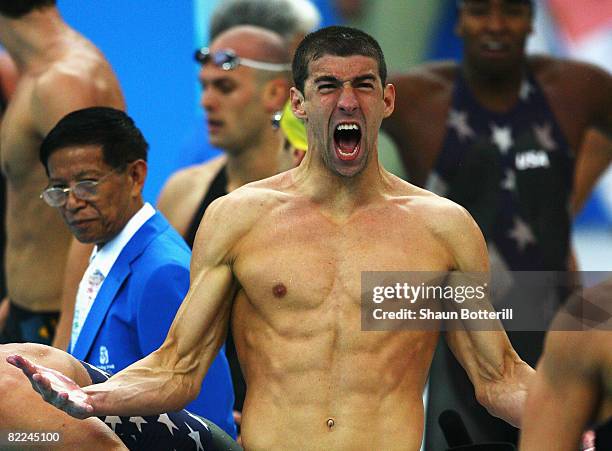Michael Phelps of the United States celebrates finishing the Men's 4 x 100m Freestyle Relay Final in first place to win the gold medal held at the...