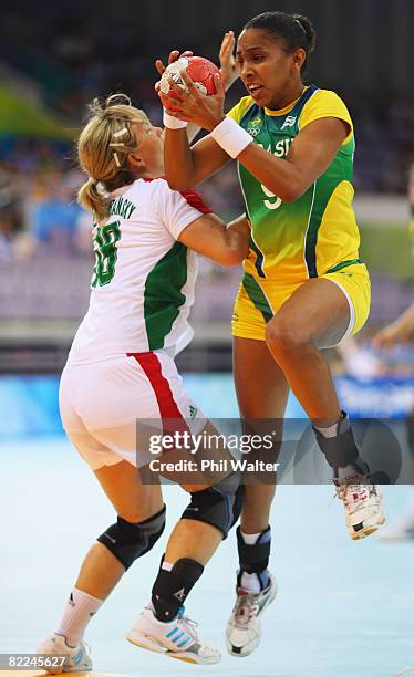 Ana Rodrigues of Brazil breaks through Hungary's defence during the Women's Handball Preliminaries Group B match between Brazil and Hungary at the...