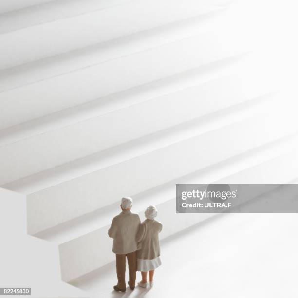 elderly couple is standing. - figurine stock pictures, royalty-free photos & images