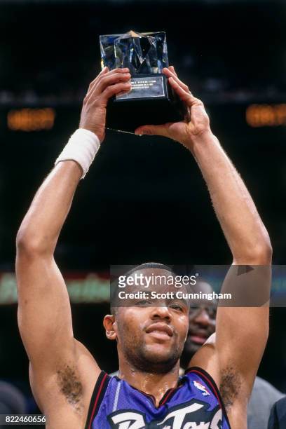 Damon Stoudamire of the Toronto Raptors celebrates winning the MVP award after the 1996 Rookie Challenge played February 10, 1996 at the Alamodome in...