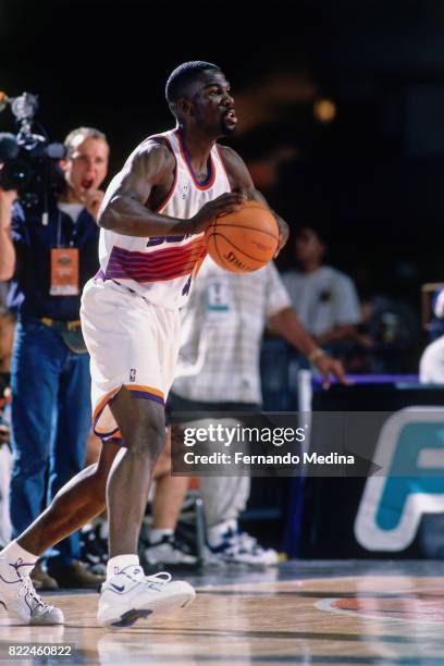 Michael Finley of the Phoenix Suns passes during the 1996 Rookie Challenge Practice on February 9, 1996 at the Alamodome in San Antonio, Texas. NOTE...