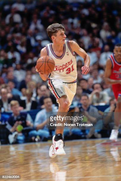 Brent Barry of the Los Angeles Clippers looks to pass during the 1996 Rookie Challenge played February 10, 1996 at the Alamodome in San Antonio,...