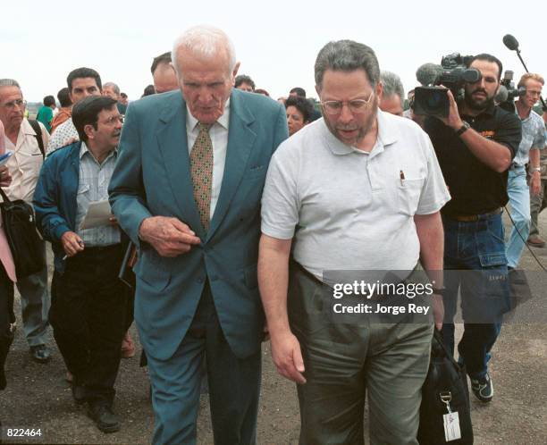 American academic Phill Brenner, right, is welcomed by Cuban Vice President Jose Ramon Fernandez March 21, 2001 at the Wayay airport in Havana, Cuba....