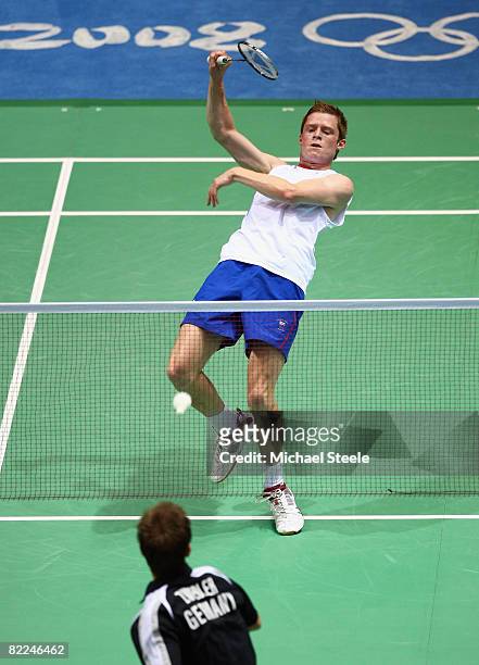 Andrew Smith of Great Britain returns during his Men's Singles match against Marc Zwiebler of Germany at the Beijing University of Technology...
