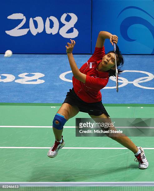 Maria Kristin Yulianti of Indonesia returns during her Women's Singles match against Tine Rasmussen of Denmark at the Beijing University of...