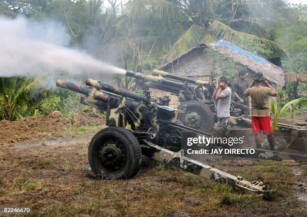 Army troops fire a 105 mm Howitzer canon into Moro Islamic Liberation Front positions in Aleosan, North Cotabato Province, southern Philippines on...