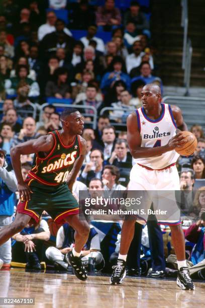 Chris Webber of the Washington Bullets looks to pass against Shawn Kemp of the Seattle SuperSonics during the 1997 All-Star Game on February 9, 1997...
