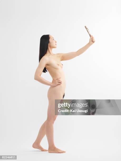 nude japanese woman looking into the mirror - woman-looking-into-mirror-full-body stock pictures, royalty-free photos & images