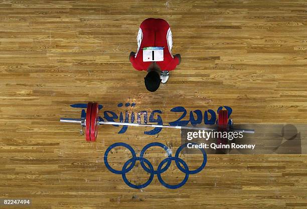 Chinthana Vidanage of Sri Lanka prays during the Men's 62kg group B weightlifting event at the Beijing University of Aeronautics & Astronautics...