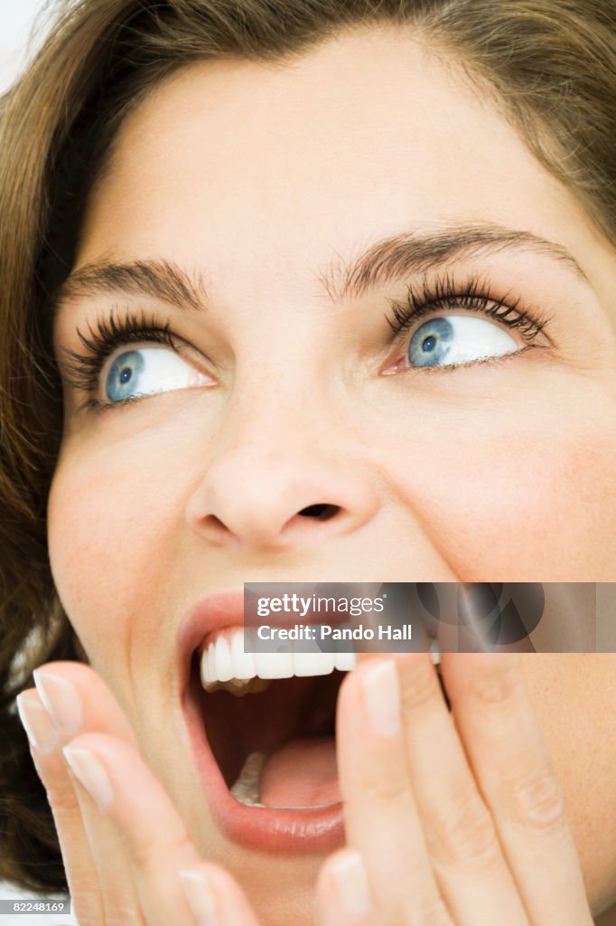 Woman looking up, yelling