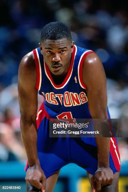 Joe Dumars of the Detroit Pistons rests on the court during a game against the Charlotte Hornets at the Charlotte Coliseum in Charlotte, North...