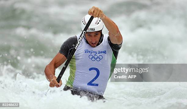 Tony Estanguet of France competes in the 2008 Beijing Olympic Games Mens's singles C1 slalom heats event at the Shunyi Rowing and Canoeing Park in...