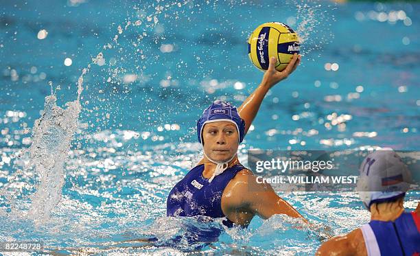 Federica Rocco of Italy shoots over Russian defender Elena Smurova during their women's water polo match at the 2008 Beijing Olympic Games on August...