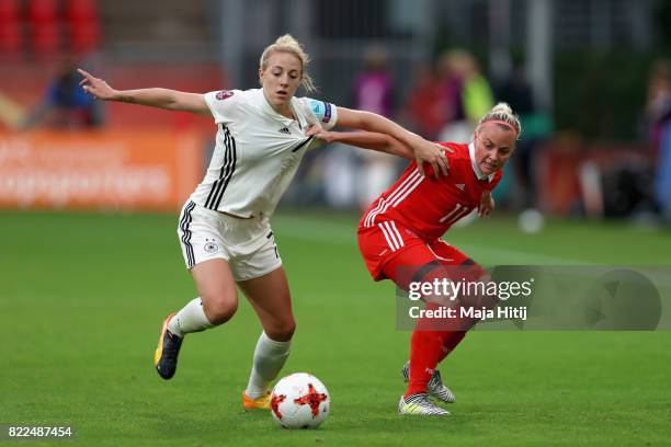 Carolin Simon of Germany and Ekaterina Sochneva of Russia battle for possession during the Group B match between Russia and Germany during the UEFA...