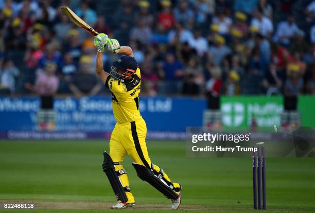 Phil Mustard of Gloucestershire is bowled by Michael Hogan of Glamorgan during the NatWest T20 Blast match between Gloucestershire and Glamorgan at...