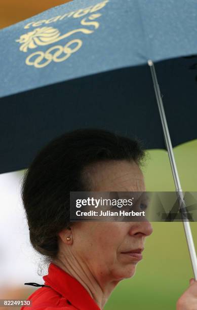 Princess Anne, the Princess Royal watches the Cross Country section of the Equestrian event at the Beas River Equestrian Venue on Day 3 of the...