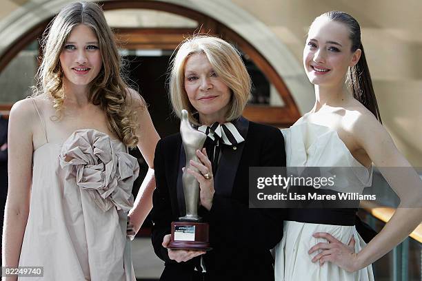 Designer Carla Zampatti poses with models wearing her designs and her Australian Fashion Laureate 2008 award at the presentation of the the...