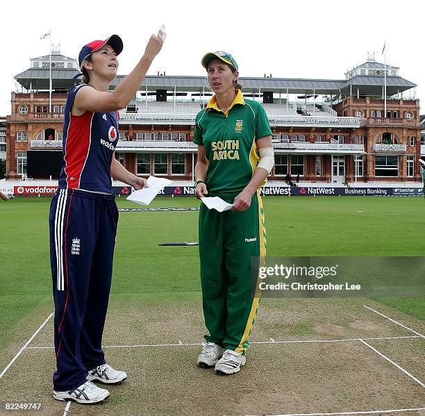 Captain Charlotte Edawrds of England and Cri-Zelda Brits of South Africa toss the coin during the Natwest Women's Series match bewteen England and...