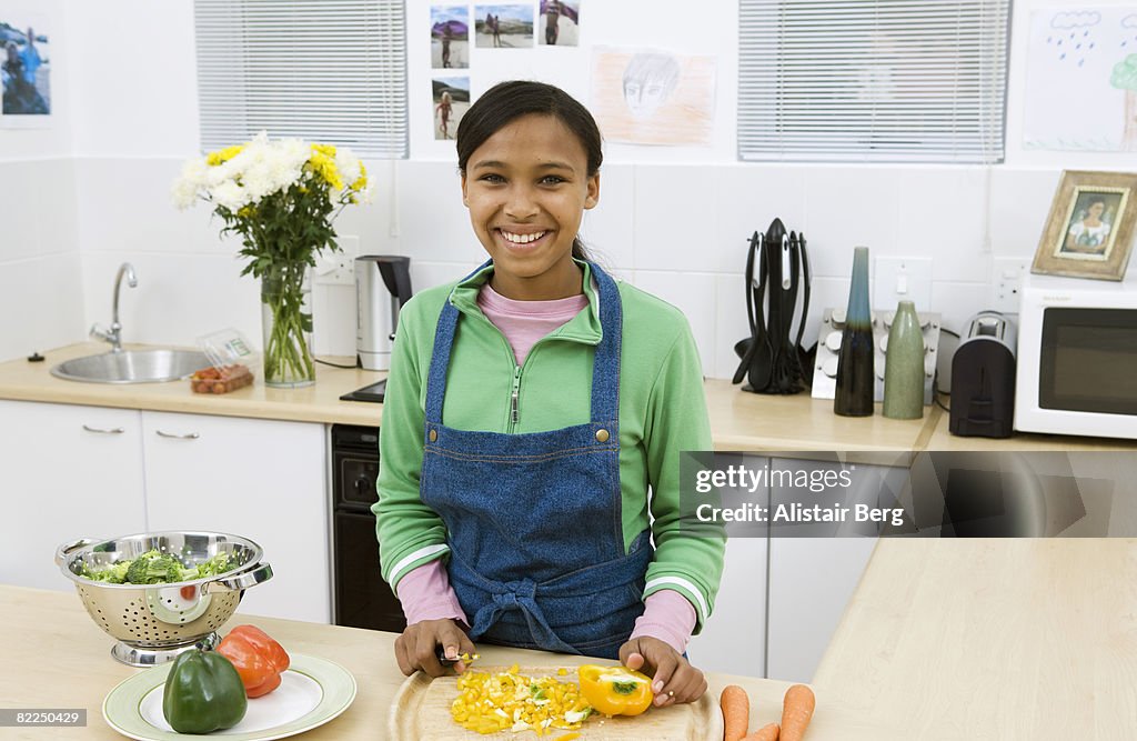 Girl cooking in kitchen