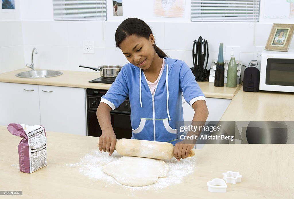 Girl making pastry in a home kitchen