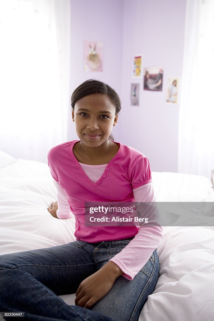 Portrait of mixed race girl sitting on