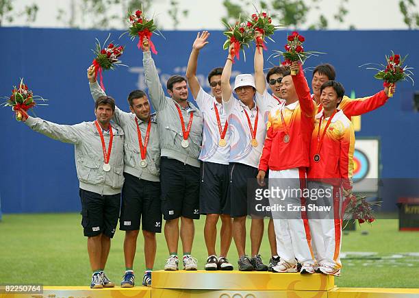 Silver medal winners Ilario Di Buo, Mauro Nespoli, Marco Galiazzo of Italy, gold medal winners Park Kyung-Mo, Lee Chang-Hwan, Im Dong-Hyun of South...