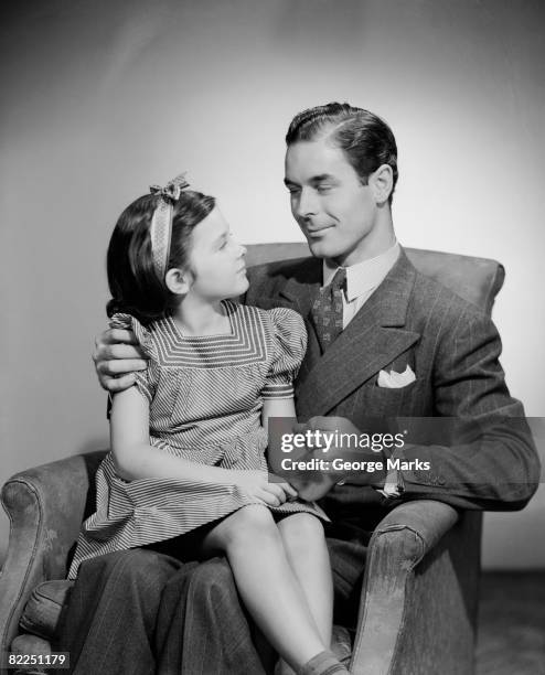 studio shot of father and daughter (10-11 years) looking in eyes - 10 11 years photos stock pictures, royalty-free photos & images