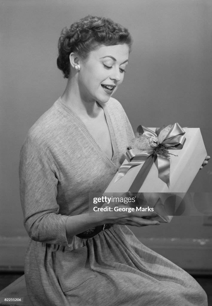 Mature woman holding gift box