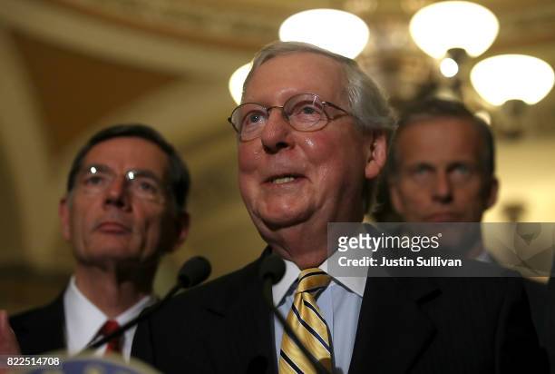 Senate Majority Leader Mitch McConnell speaks to reporters during a news conference on Capitol Hill following a procedural vote on the GOP health...