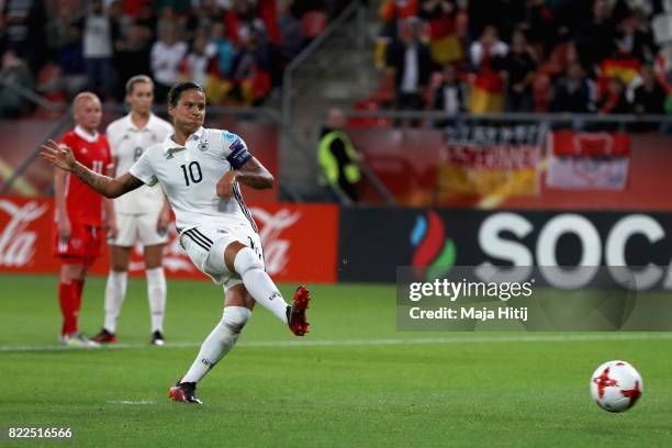 Dzsenifer Marozsan of Germany scores her sides second goal from the penalty spot during the Group B match between Russia and Germany during the UEFA...