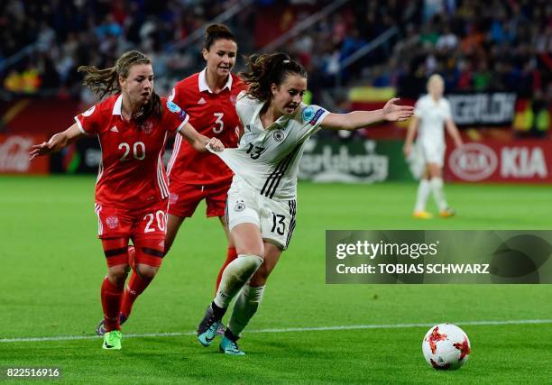 Russia's midfielder Margarita Chernomyrdina fouls Germany's midfielder Sara Daebritz during the UEFA Women's Euro 2017 football match between Russia...