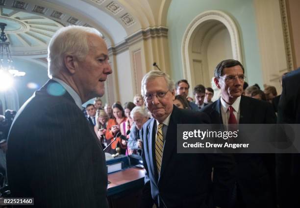 Sen. John Cornyn , Senate Majority Leader Mitch McConnnell and Sen. John Barrasso leave the podium after speaking to reporters following a procedural...