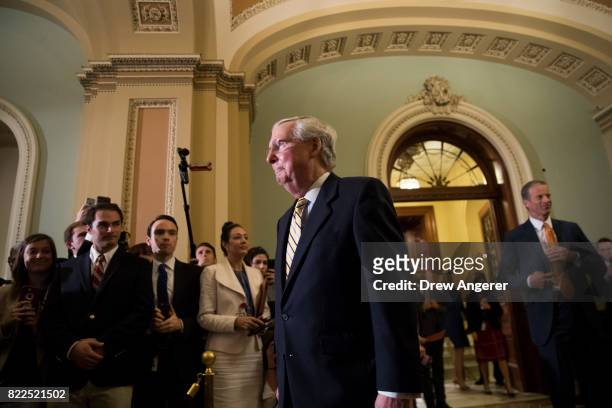 Senate Majority Leader Mitch McConnnell emerges from the Senate Chamber following a procedural vote to open debate on the GOP heath care plan, on...