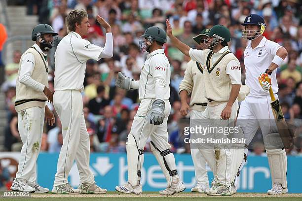 Paul Harris of South Africa celebrates with team mates after taking the wicket of Kevin Pietersen of England during day five of the 4th npower Test...