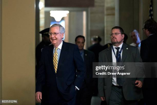 Senate Majority Leader Mitch McConnnell leaves his office and walks to a meeting of GOP senators, on Capitol Hill, July 25, 2017 in Washington, DC....