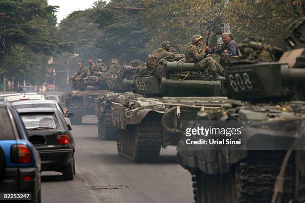 Georgian soldiers ride a tank through the streets August 11,2008 near Gori, Georgia. Both Russia and Georgia have accused each other of continued...