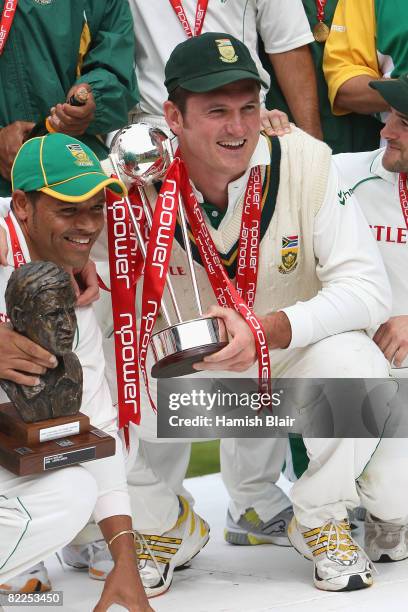 Graeme Smith of South Africa celebrates with the trophy after winning the series 2 - 1 during day five of the 4th npower Test Match between England...