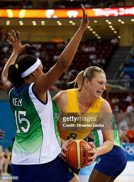 Suzy Batkovic of Australia looks to pass the ball against Kelly Santos of Brazil during their women's basketball game on Day 3 of the Beijing 2008...