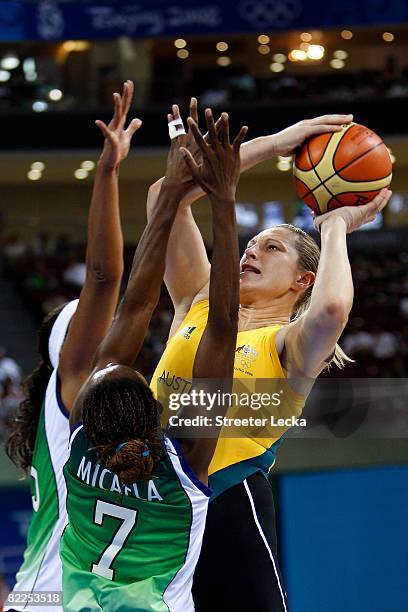 Suzy Batkovic of Australia attempts a shot against Micaela Jacinto of Brazil during their women's basketball game on Day 3 of the Beijing 2008...