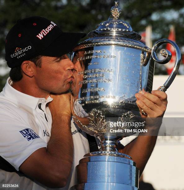 Irish golfer Padraig Harrington holds the trophy after winning the 90th PGA Championship at Oakland Hills Country Club on August 10, 2008 in...