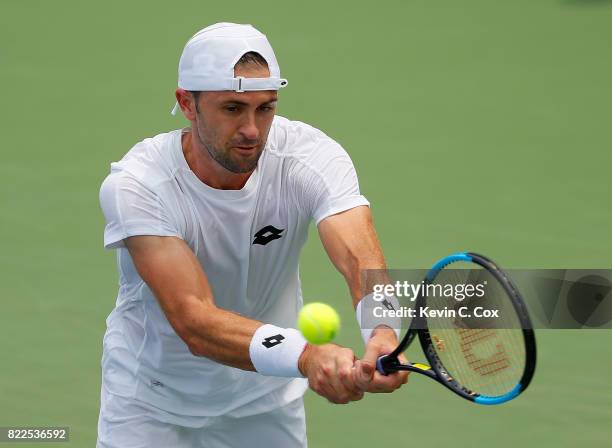 Tim Smyczek returns a backhand to Donald Young during the BB&T Atlanta Open at Atlantic Station on July 25, 2017 in Atlanta, Georgia.