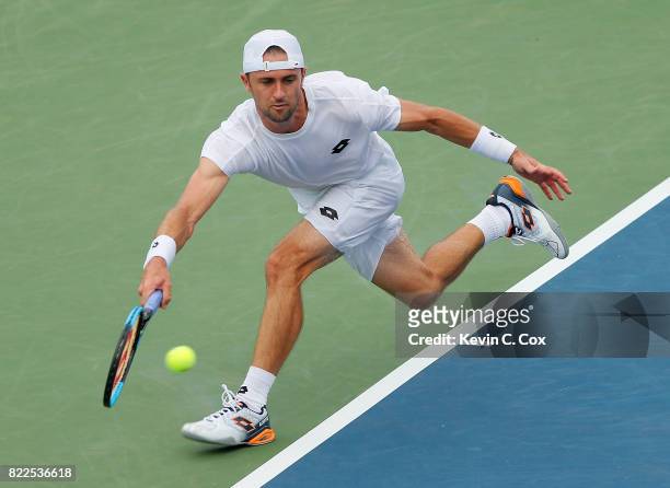 Tim Smyczek returns a forehand to Donald Young during the BB&T Atlanta Open at Atlantic Station on July 25, 2017 in Atlanta, Georgia.