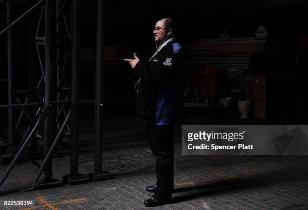 Trader stands outside of the New York Stock Exchange on July 25, 2017 in New York City. The Dow Jones industrial average rose over 100 points as...