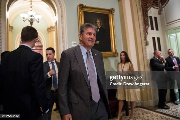 Sen. Joe Manchin walks through the Capitol before a procedural vote on the GOP heath care plan, on Capitol Hill, July 25, 2017 in Washington, DC. The...