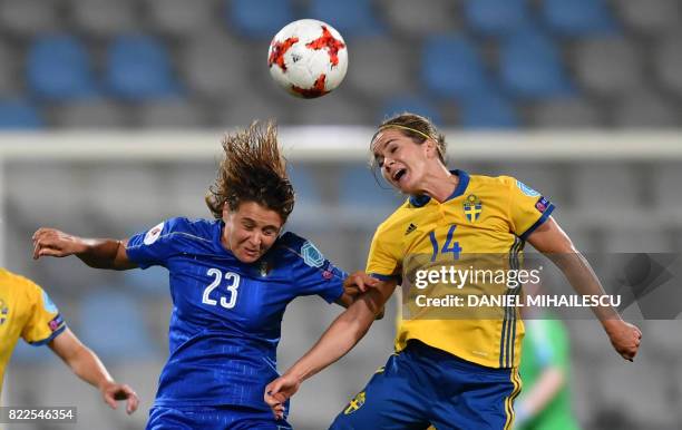 Sweden's Hanna Folkesson heads the ball with Italy's Cristiana Girelli during the UEFA Women's Euro 2017 football match between Sweden and Italy at...