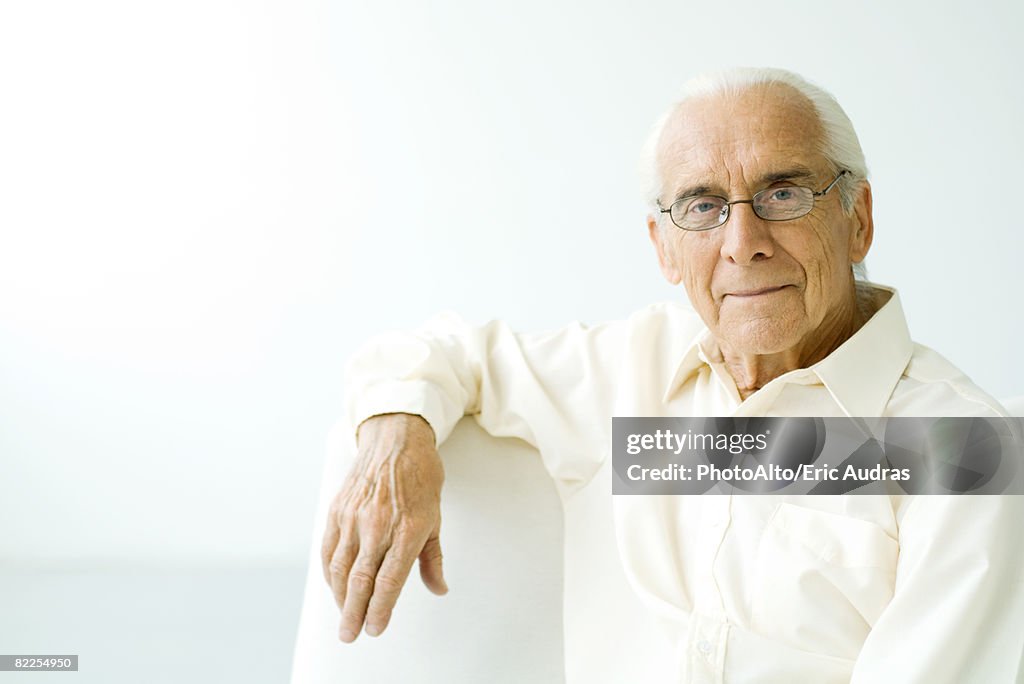 Senior man smiling at camera, portrait
