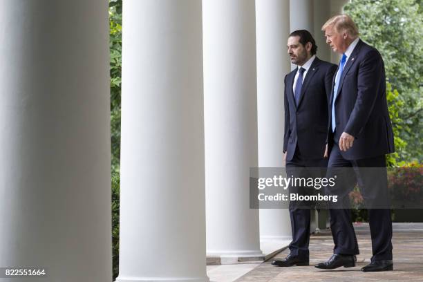 President Donald Trump, right, and Saad Hariri, Lebanon's prime minister, walk to a joint press conference in the Rose Garden of the White House in...