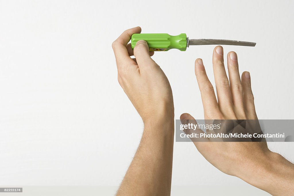 Hands holding sharp file