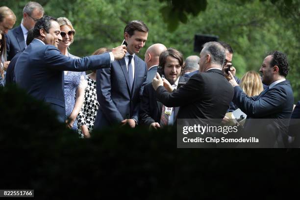 Members of the official Lebanese delegation and journalists pose for selfies with President Donald Trump's daughter Ivanka Trump and her husband,...
