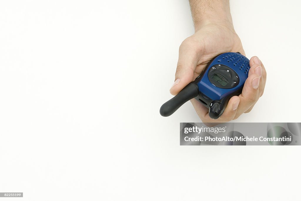 Hand holding walkie-talkie